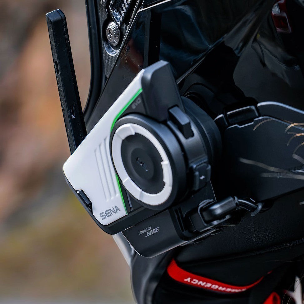 Moto Explorer Sena 60S EVO motorcycle communication system mounted on a helmet with white and black design